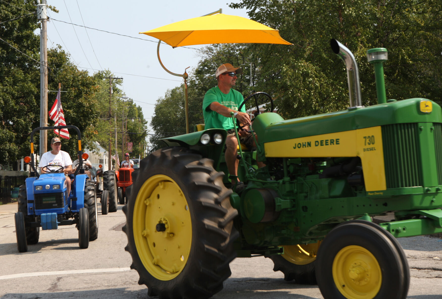 George Miller and Wes Wissmann drive tractors
